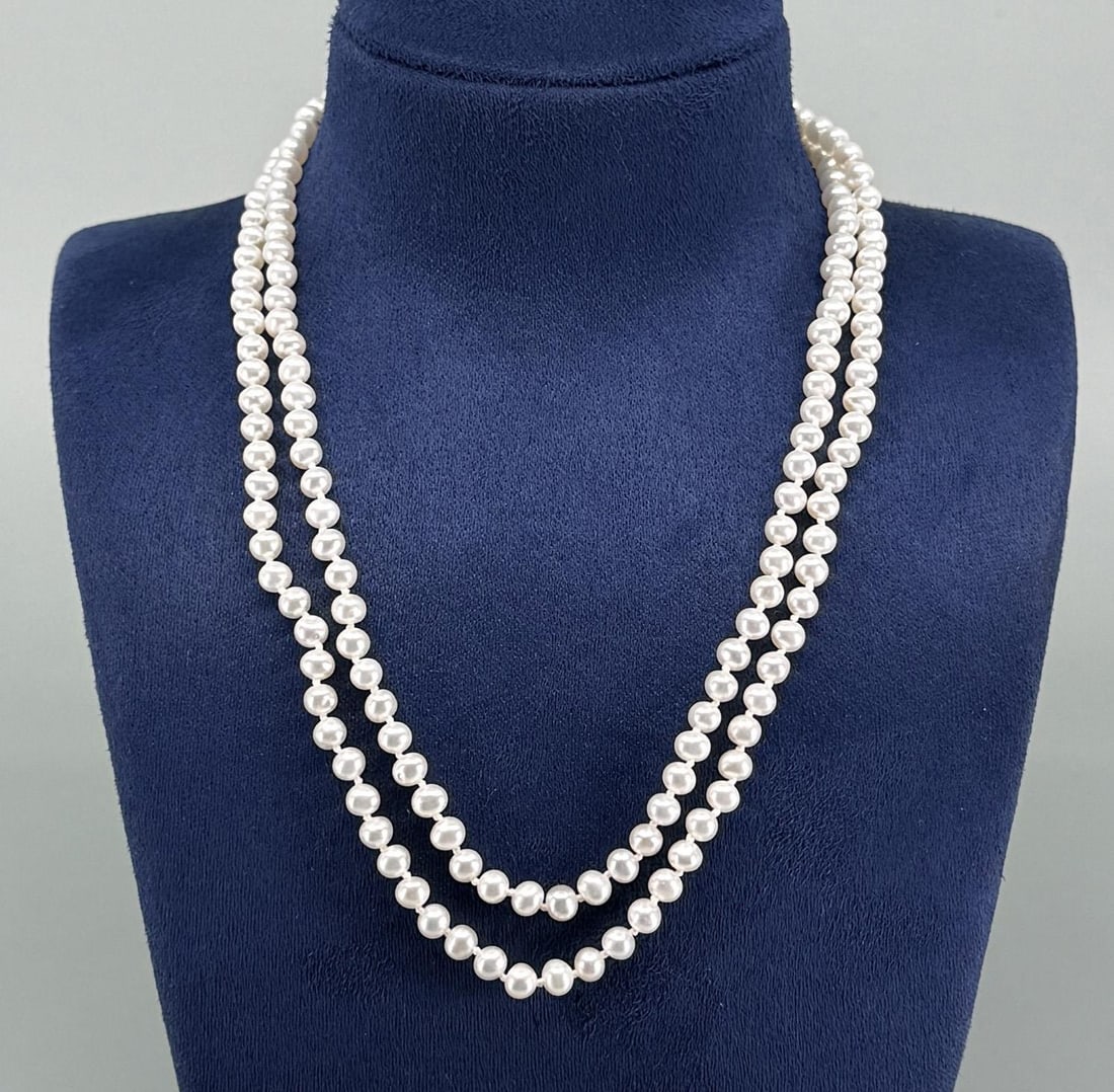 Cultured Pearl Necklace 14k Gold Clasp: 14 7/8" long.