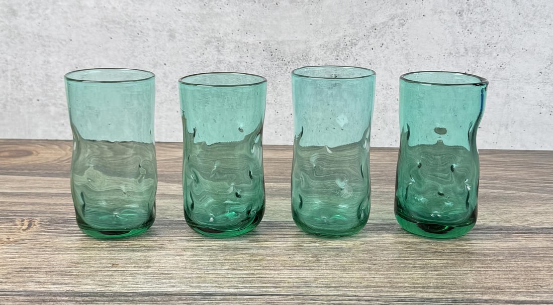 Blenko Art Glass Dimpled Glass Tumbler Set: Four total. 6" tall by 3" in diameter. Surf Green