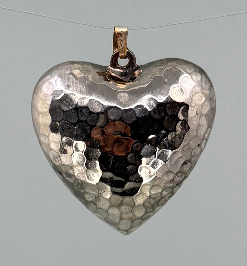 Hammered Sterling Silver Puffy Heart Pendant: 1 1/4" long. 9.79 grams.