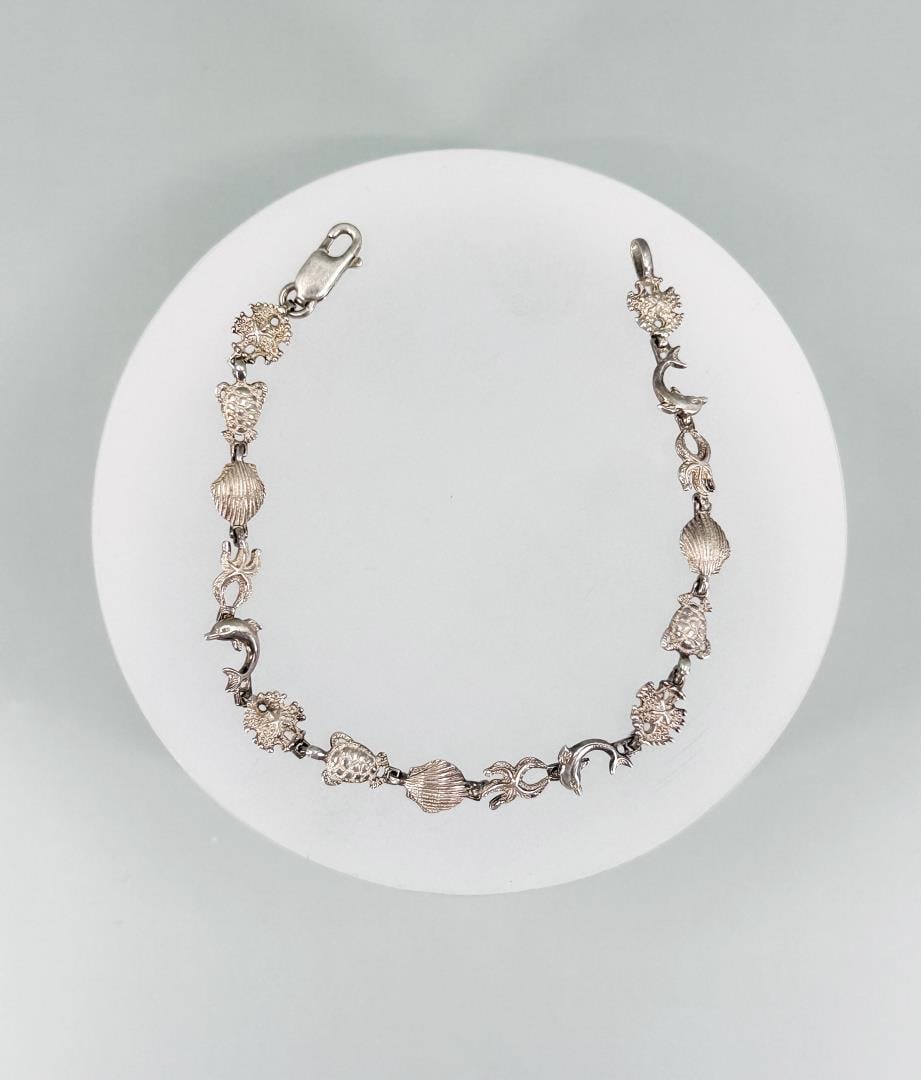 Sterling Silver Sea Creatures Bracelet: 7" long open.