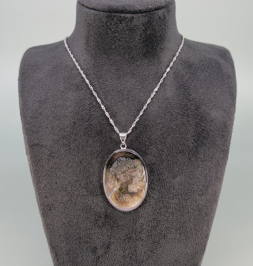 Bella Luce Sterling Mother of Pearl Cameo Necklace: 11 1/2" long.