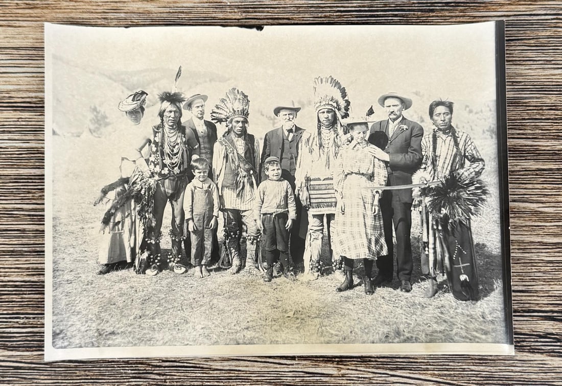 Edward Boos Flathead Indian Montana Photo: 5" by 7". Doctor Parsons and group of six white people and four Indians. One Indian is holding a sword being looked at by a young lady. Boos #751. Tipis and hills can be seen in the background. Boos' 