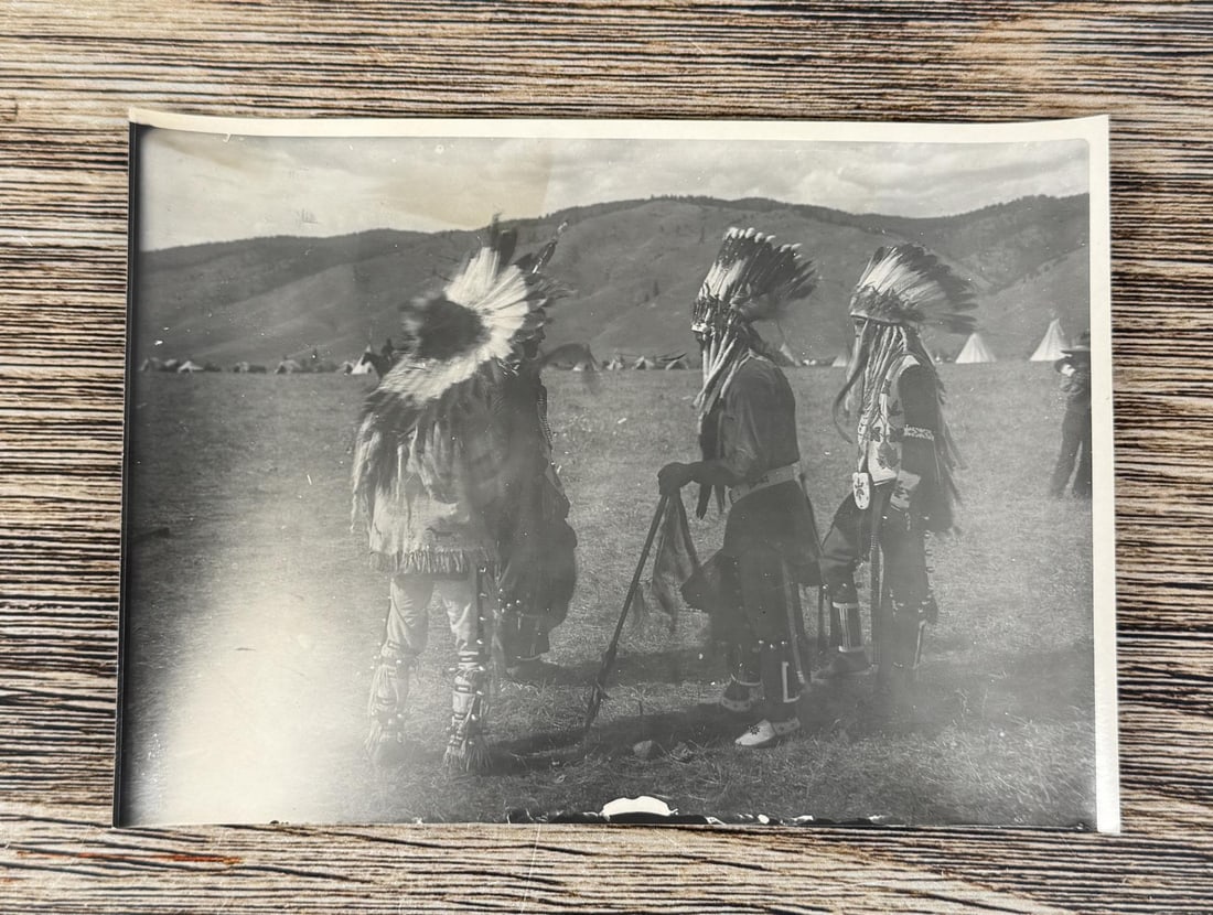 Edward Boos Flathead Indian Montana Photo: 5" by 7". Paul Lumphrey, Louis Left Hand, Chines- e-m, Peter Stevens. Four Native American men pose in Native American attire. Three wear headdresses, and the fourth man has a feather in his hair. Tip