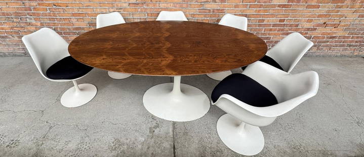 Eero Saarinen for Knoll Oval Rosewood Tulip Table: Comes with matching chairs. Table is 78" by 48" by 29". Lot requires pickup at our facility or LTL freight shipping.