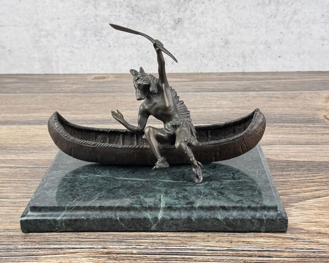 Carl Kauba Indian in Canoe Bronze: Title is Indian and Canoe. 10" by 7" by 7" Carl Kauba (1865 - 1922) was active/lived in Austria, United States. Carl Kauba is known for Sculpture-western figure, Native American. This Austrian sculpto