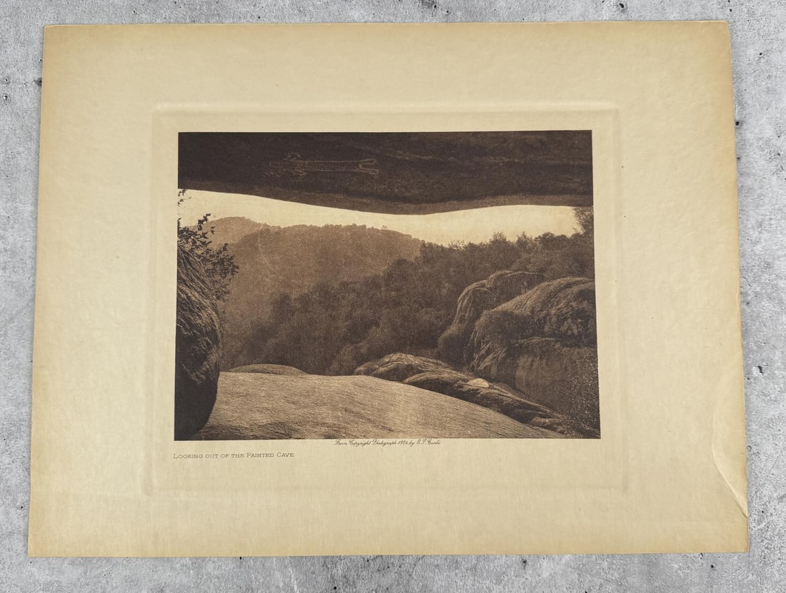 Edward Curtis Photogravure Painted Cave: Looking out of the Painted Cave. Original 1924 photogravure from Edward Curtis The North American Indian. 9 1/2" by 12 1/2".