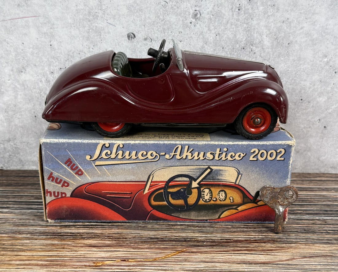 Schuco Akustico 2002 Wind Up Toy Car: Both car and horn work. In original box.