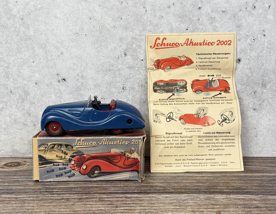 Schuco Akustico 2002 Wind Up Toy Car: Both car and horn work. In original box.