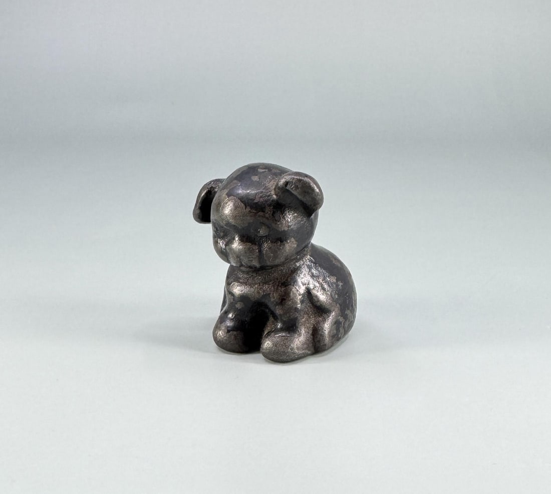 Griswold Pup Cast Iron Paperweight: 1 1/2" by 1 1/2" by 1 1/4".