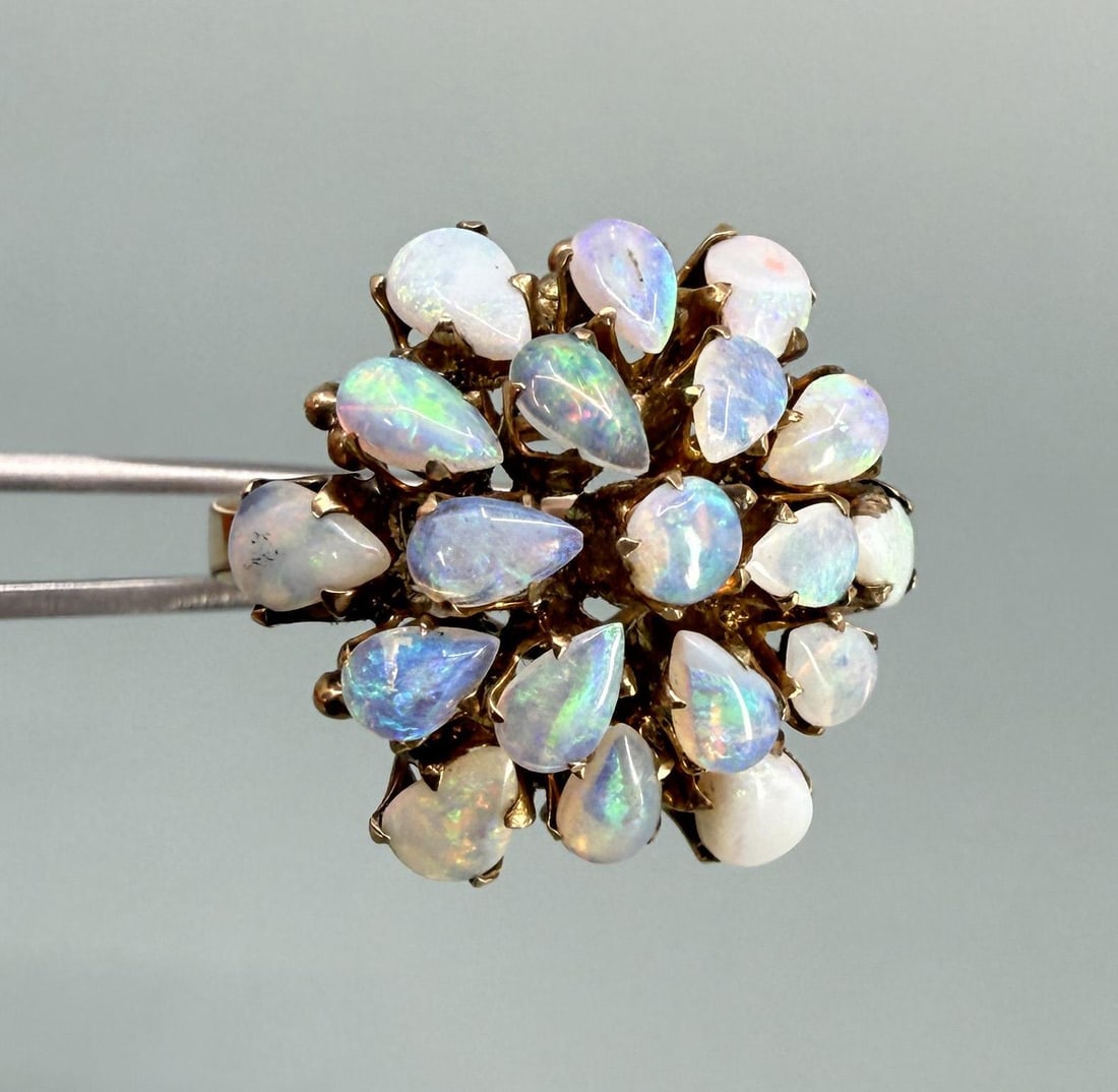 10K Gold Opal Cluster Cocktail Ring: Size 7. 5.22 grams. Stamped 18k but tests out at 10K.