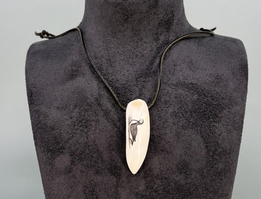 Alaskan Eskimo Inuit Scrimshaw Puffin Necklace: Necklace in total is 13" long. Carved walrus material. Native made prior to 1972. This item cannot be shipped to Oregon, California, Hawaii, New York, New Jersey, Internationally, or any other state t