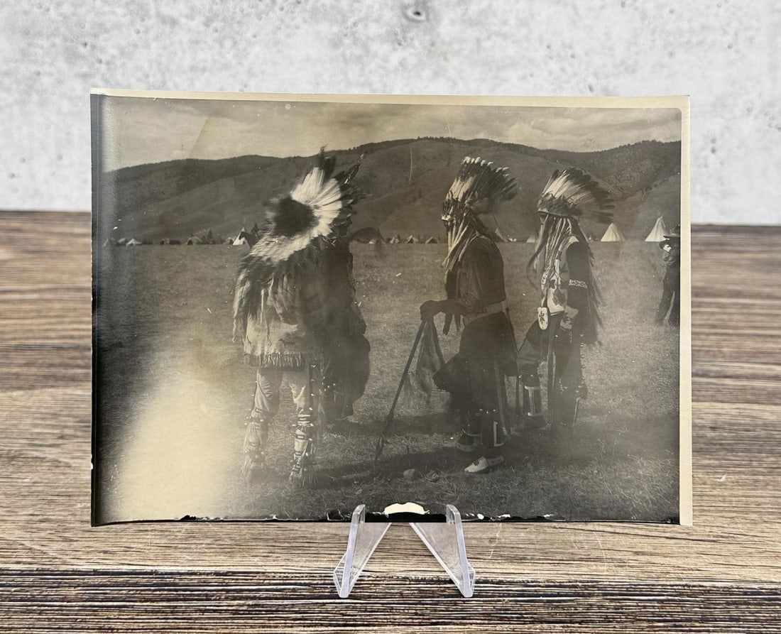 Edward Boos Flathead Indian Montana Photo: 5" by 7". Paul Lumphrey, Louis Left Hand, Chines- e-m, Peter Stevens. Four Native American men pose in Native American attire. Three wear headdresses, and the fourth man has a feather in his hair. Tip