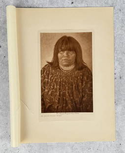 Edward Curtis Photogravure An Apache Mohave Woman: Original 1908 Gampi Tissue Photogravure from Edward Curtis The North American Indian Volume 2. 9" by 12". Cover and Mounting paper are torn but tissue is undamaged.