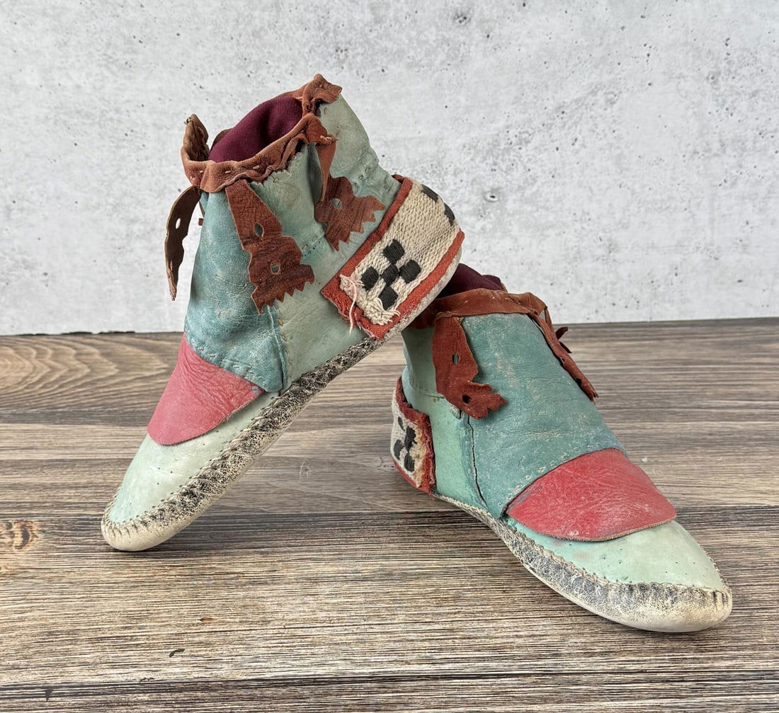 Antique Hopi Pueblo Moccasins: 10 1/2" long by 5 1/2" tall by 4 1/2" wide. First quarter of the 20th Century. Provenance: From the estate of Iris Apfel. Apfel August 29, 1921 ? March 1, 2024 was an American businesswoman, interior