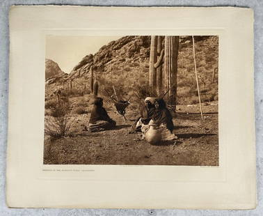 Edward Curtis Resting In The Harvest Field: Qahatika Photogravure. Resting In The Harvest Field - Qahatika Plate 55. From copyright 1907 photograph by Edward Curtis The North American Indian Portfolio Volume Two. Published by John Andrew & Son.