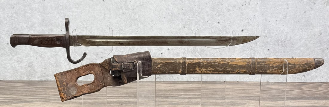 WW2 Japanese Type 30 Arisaka Bayonet: Scarce with frog and wooden scabbard. Appears that the bayonet was captured and reissued by another military.