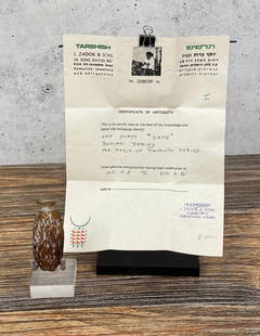 Ancient Sidonian Roman Glass Date Perfume Flask: Roman Empire, Lebanon, Sidonian. Circa 1st-3rd Century AD. 2 1/2" long, 1 1/8" diameter. Provenance: Ex Nelson Rockefeller / Megan Marshack Collection, accompanied by an original sales receipt from J.