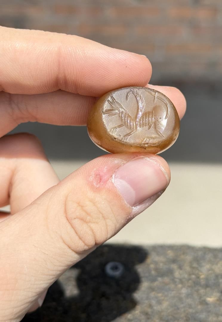 Ancient Sasanian Empire Griffin Seal Stamp Bead: Circa 2nd to 7th century. The Sasanian Empire became what is now modern Iran. 1" by 3/4". Provenance: Ex Nelson Rockefeller / Megan Marshack Collection