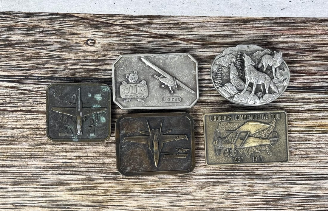 Collection of Aviation Related Belt Buckles: Hornet, Cub, A7, Lindbergh Tour.
