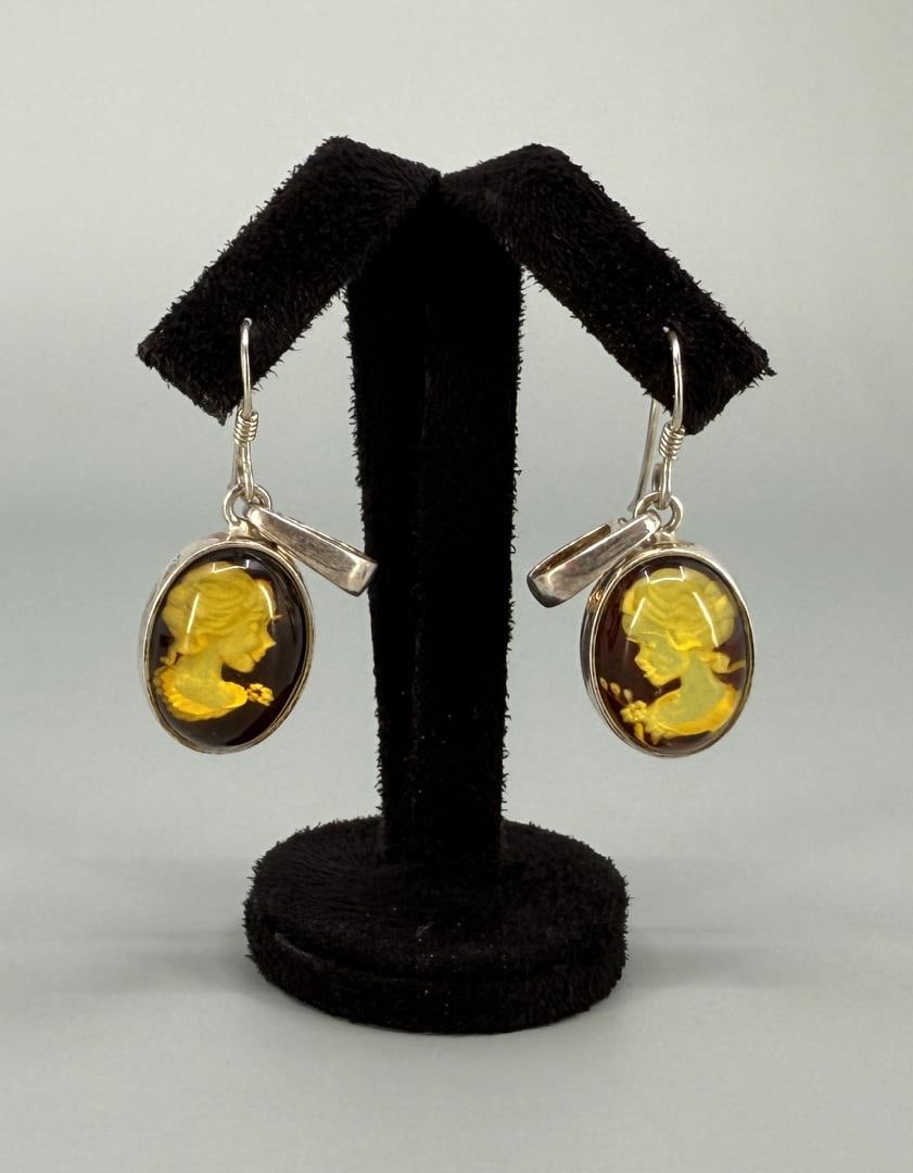 Sterling Silver Intaglio Carved Amber Earrings: 1 1/8" long.