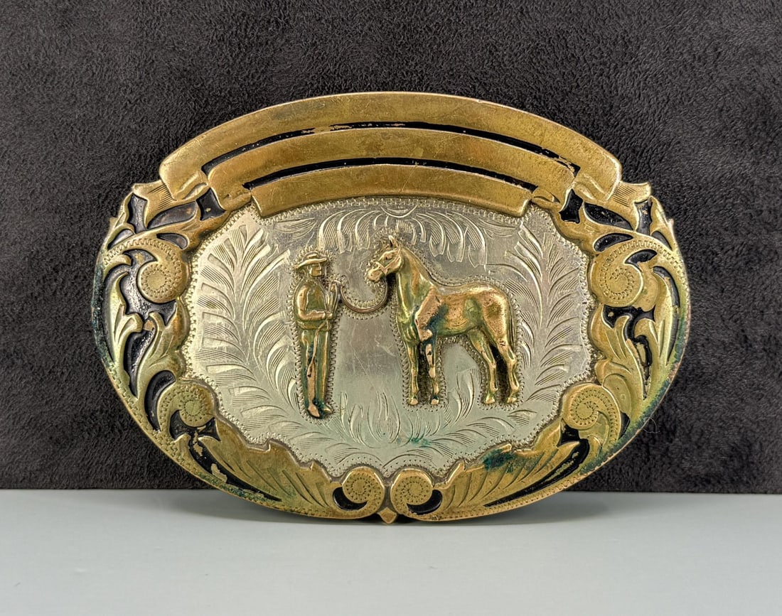 Comstock Silversmiths Cowboy Belt Buckle: 4" long.