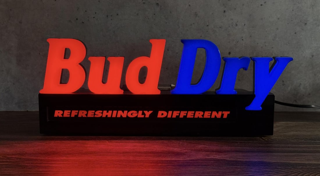 Bud Dry Beer Lighted Sign: Working. 23" by 9" by 7 5/8".