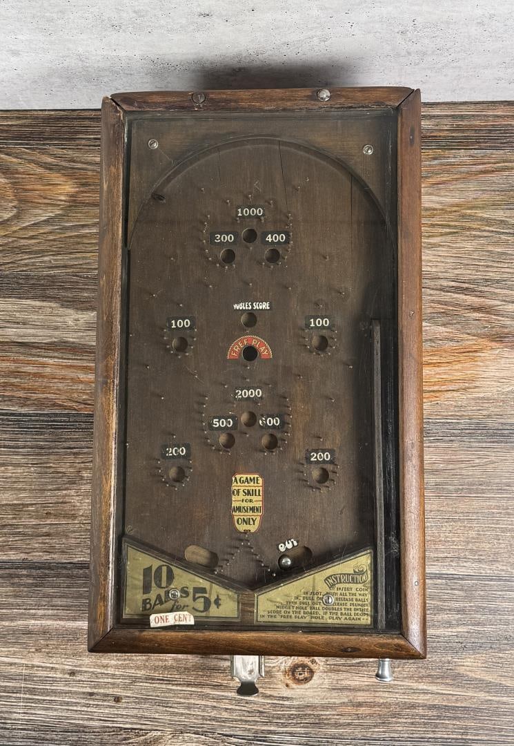 Antique Pinball Machine Trade Stimulator: Working condition, however jams occasionally. Contains five balls. 24 7/8" by 12 5/8" wide.
