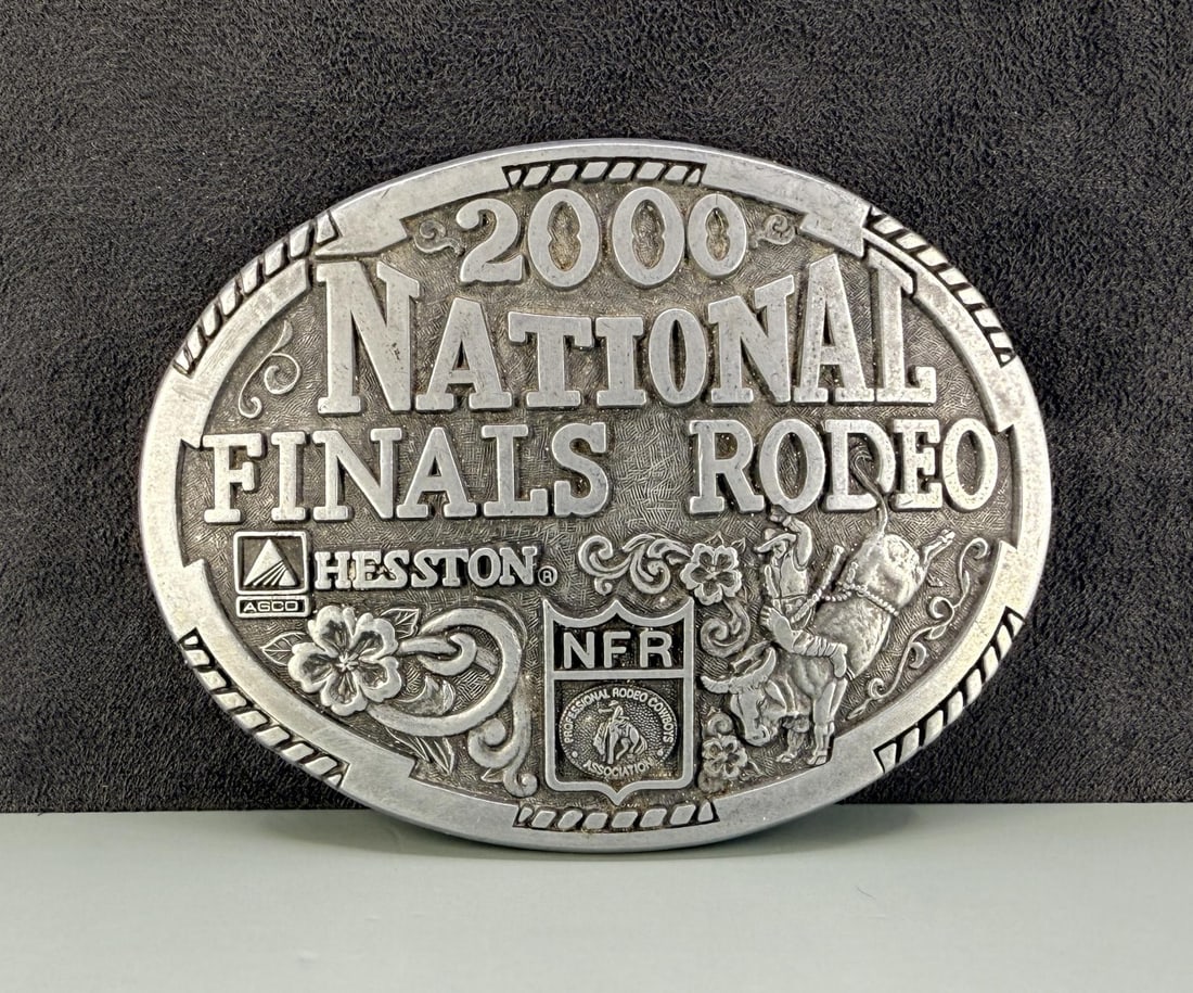 Montana Silversmiths Hesston Rodeo Belt Buckle: 2000 National Rodeo Finals. 3 7/8" wide.