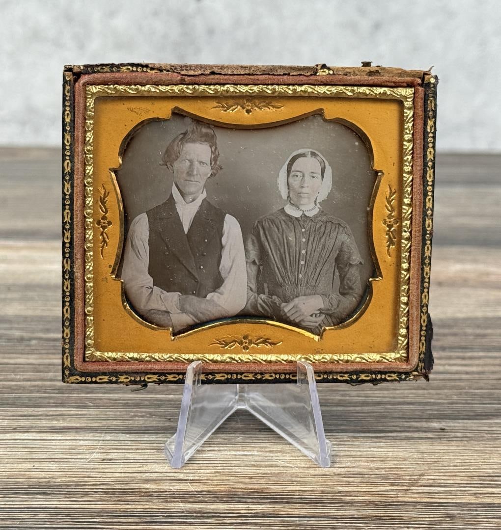 Antique Daguerreotype Photo Farm Couple: Hard Working Plain Dressed Couple with Worn Clothing. 3 1/4" by 3 3/4" cased.