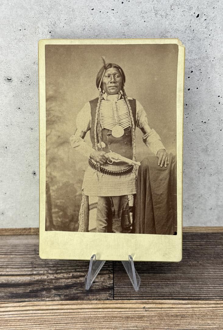 Big Jim Forehand Revolver Indian Cabinet Photo: Holding a Forehand and Wadsworth Army Revolver. 4 1/4" by 6 1/2". Big Jim was a Havasupai man born in the 1850s, at Indian Garden, where his family had, for generations, maintained a perennial garden 