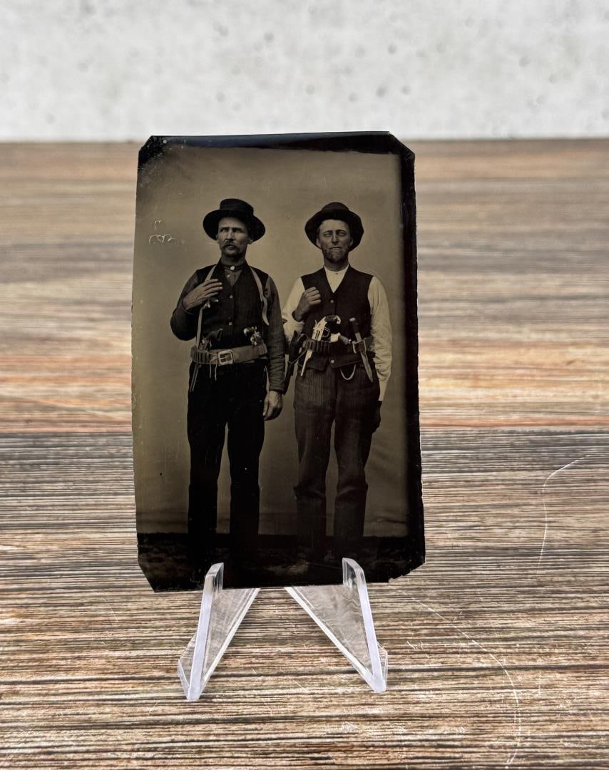 Sheriff Sheridan County Kansas Nebraska Tintype: Back of image has a note which reads Sheriff of Sheridan County. 2 1/4" by 3 5/8". The subject at right has multiple weapons tucked in his belt, most notably a Merwin, Hulbert, and Co. open-top Pocket