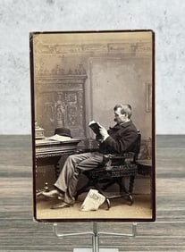 Man Reading Book Cabinet Photo