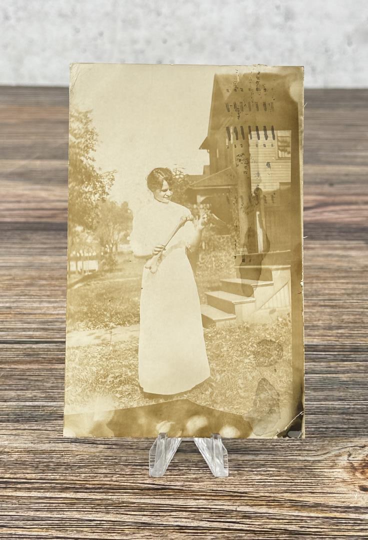 Woman Holding Human Femur RPPC Postcard: Unusual early image.