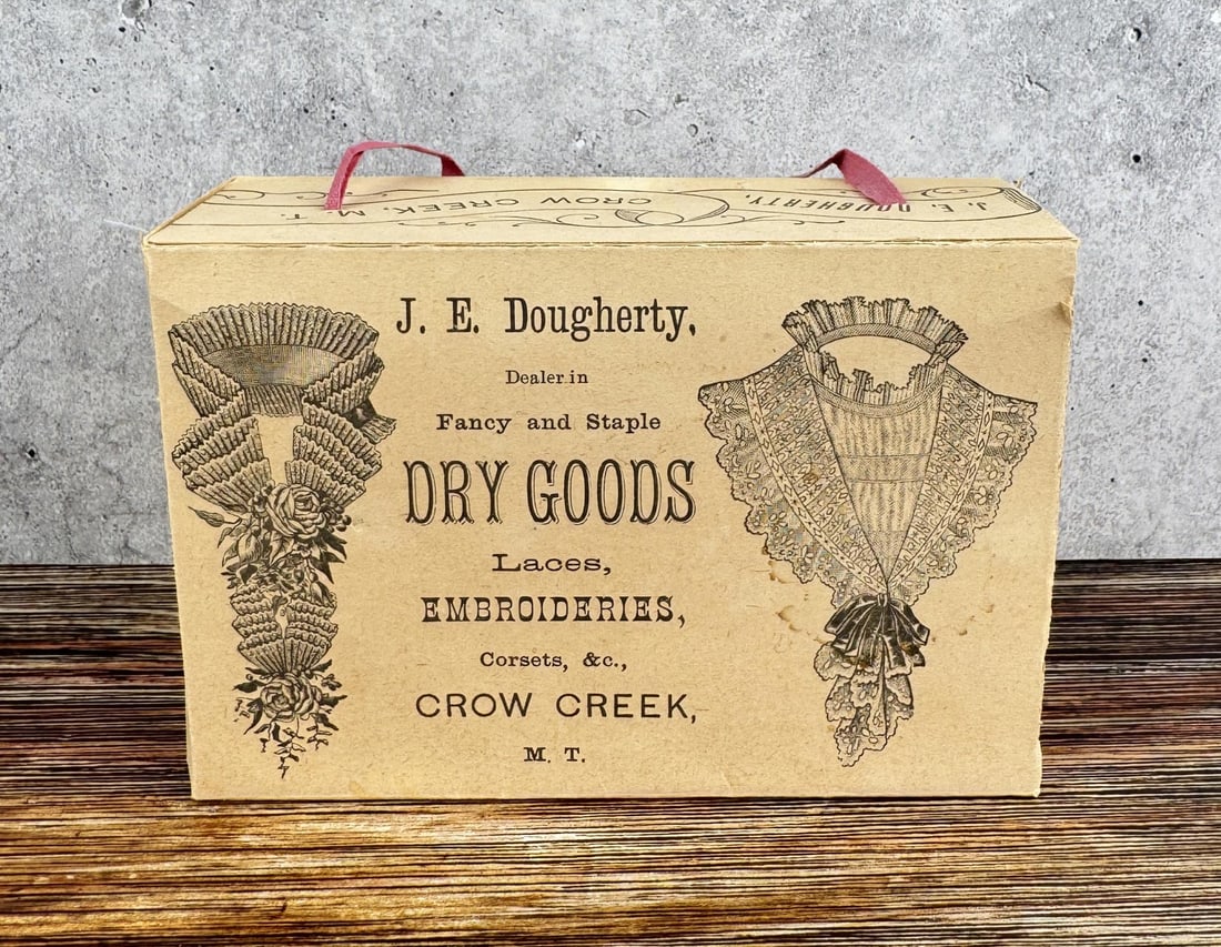 Dougherty Dry Goods Crow Creek Montana Territory: Laces, Embroideries, Corsets. Crow Creek Montana Territory. Scarce early box. 6" by 3 3/4" by 3".