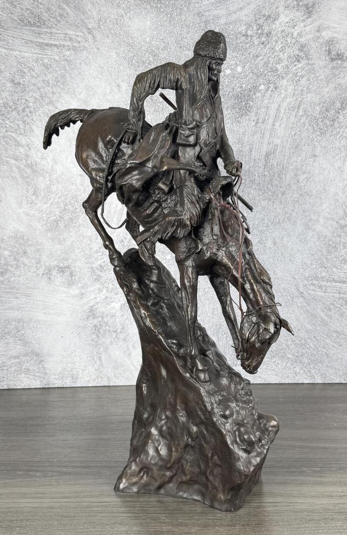 Frederic Remington The Bronco Buster Bronze: Title is Mountain Man. 27" by 20" by 10". 54lbs. Frederic Sackrider Remington (1861 - 1909) was active/lived in New York, Kansas, Connecticut. Frederic Remington is known for Western painting and scul