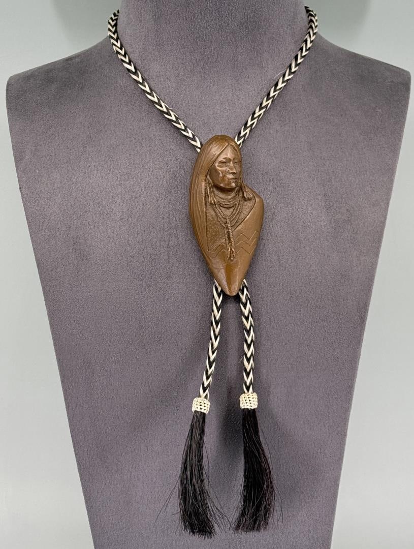 Oreland C. Joe 2008 Prix de West Bronze Bolo Tie: Title is Ute Maiden. 21" long on bolo. Orland Joe is known for Sculpture.