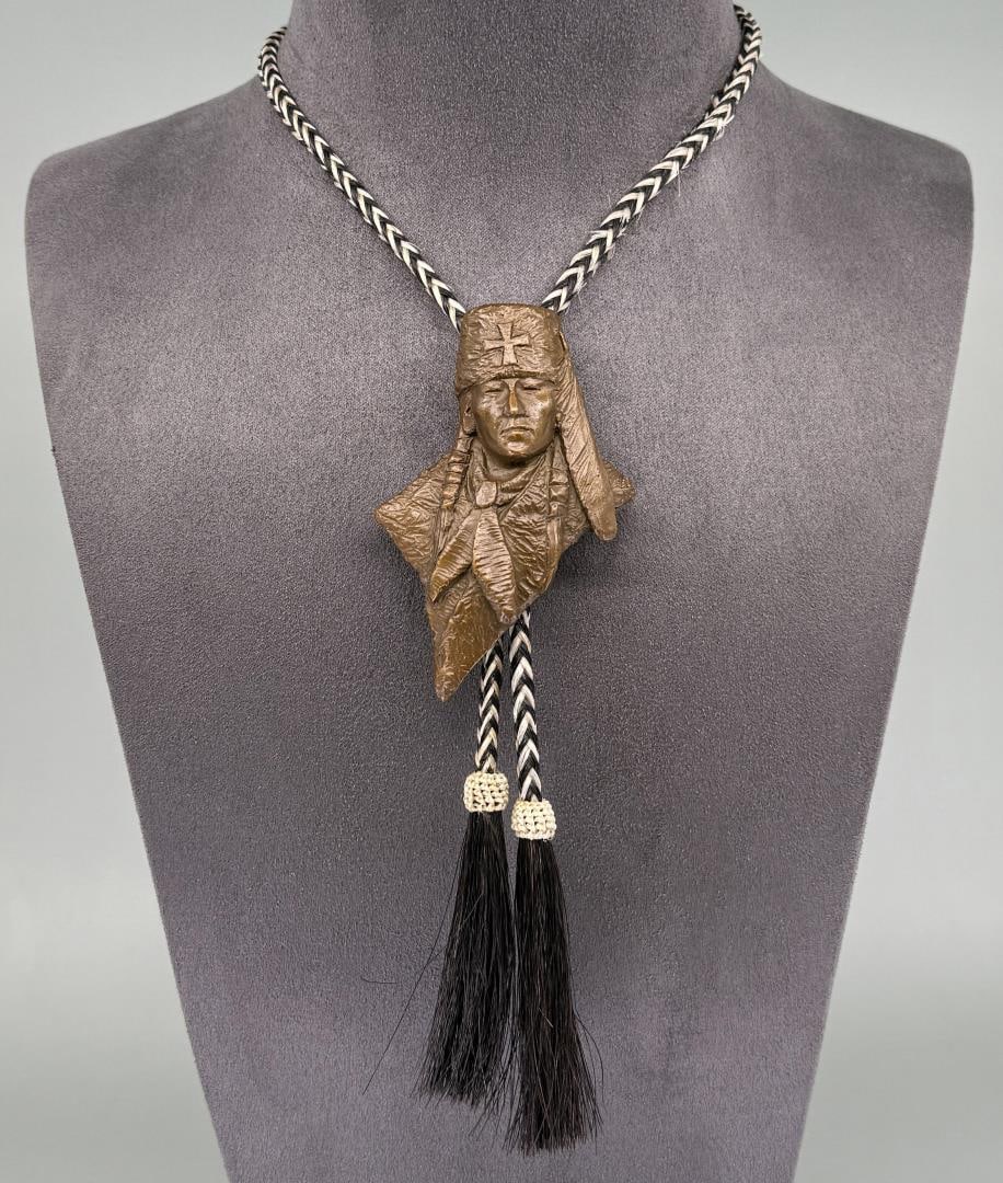 Oreland C. Joe 2008 Prix de West Bronze Bolo Tie: Title is Ute Warrior. 19 7/8" long on bolo. Orland Joe is known for Sculpture.