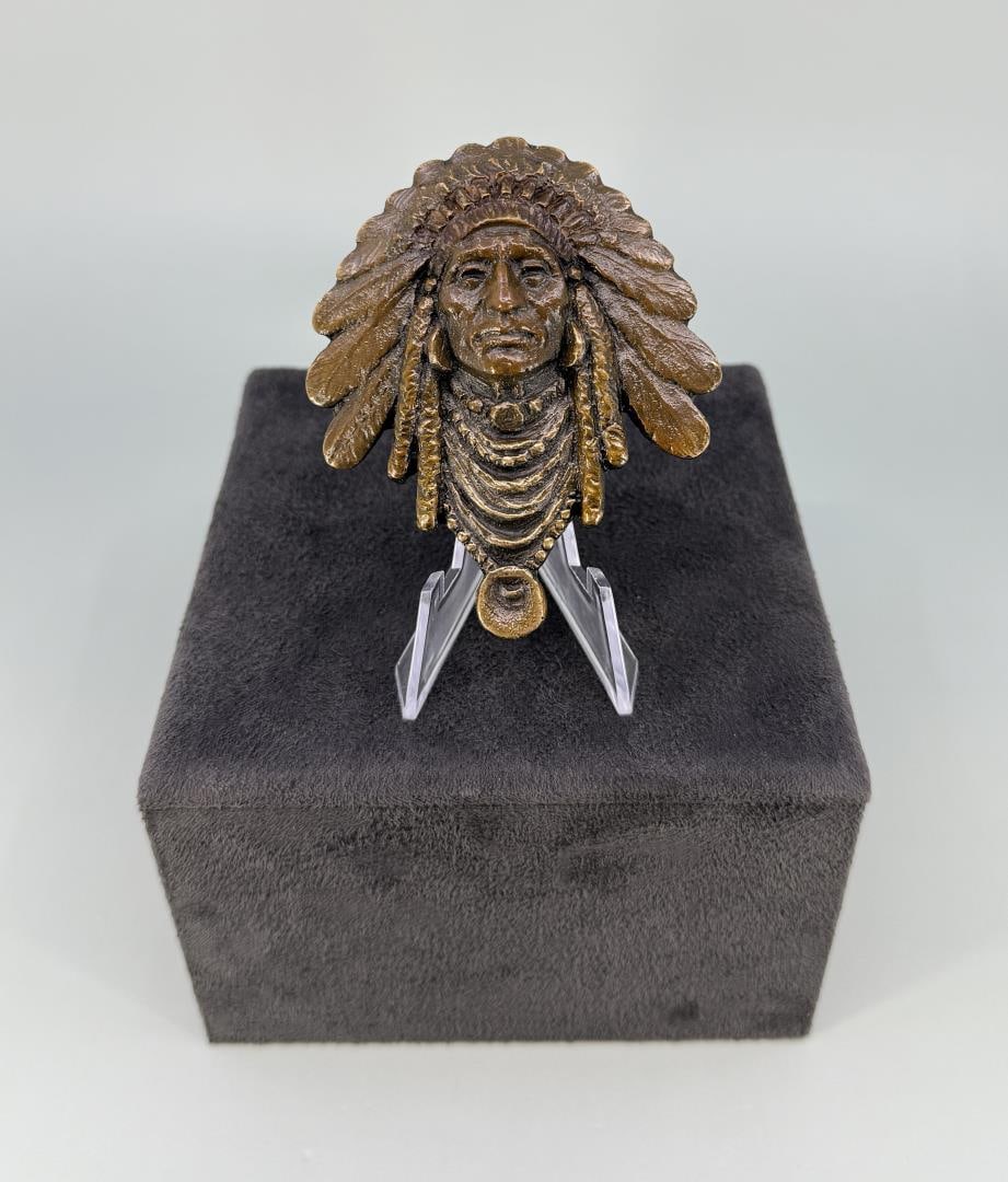 Blair Buswell 2013 Prix de West Bronze Bolo Tie: Title is Chief. 3 1/2" long. Blair Buswell (Born 1956) was active/lived in Utah, Arizona. Blair Buswell is known for Sport figure sculpture, illustration, teaching. A sculptor of portraits of sports f