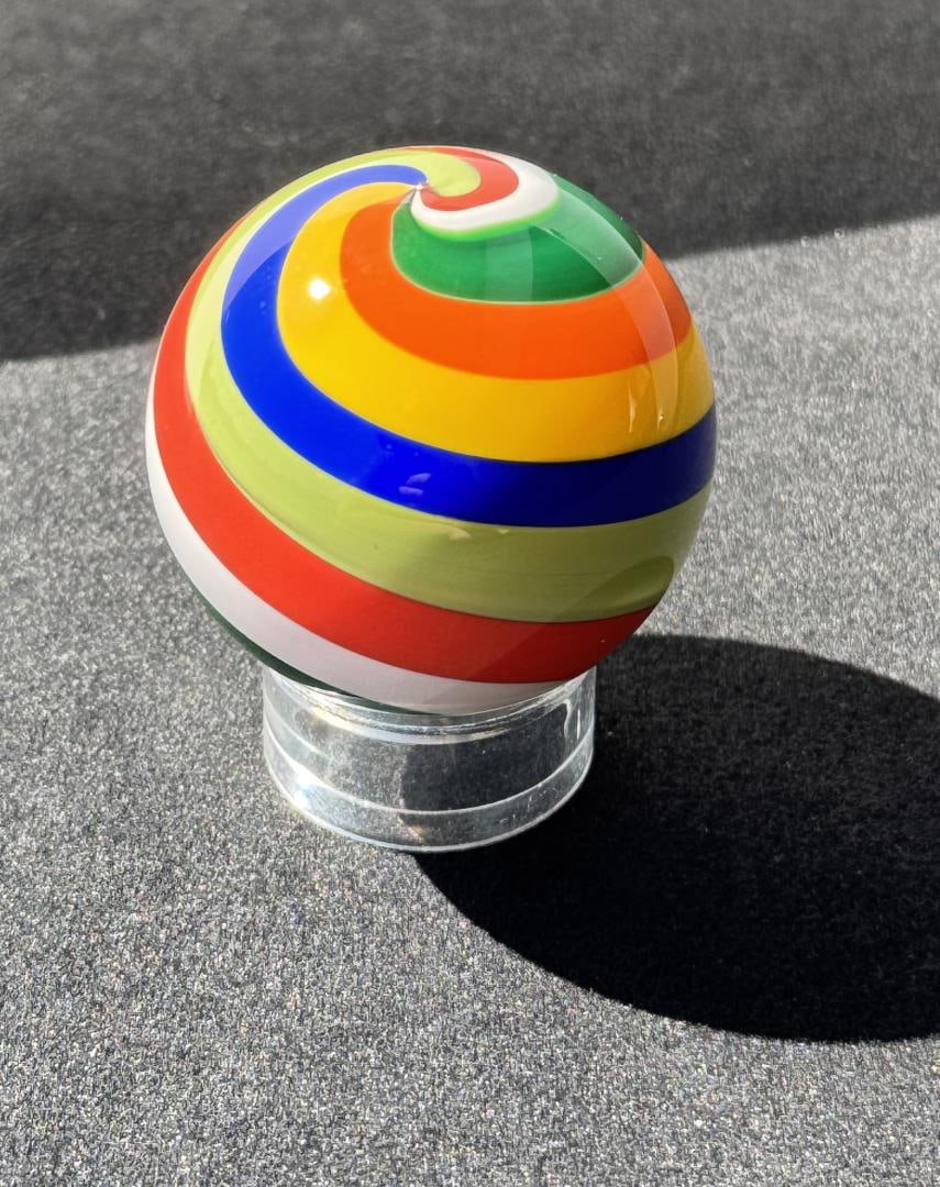 Fritz Lauenstein Art Glass Marble: Measures 1 3/5" in diameter. Fritz Glass is owned & operated by the husband & wife team of Fritz Lauenstein and June Raymond. Fritz started blowing glass in 1974 at Gould Academy in Bethel, Maine. He