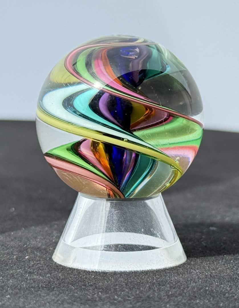 Fritz Lauenstein Art Glass Marble: 1 1/2" Diameter. Unsigned. Fritz Glass is owned & operated by the husband & wife team of Fritz Lauenstein and June Raymond. Fritz started blowing glass in 1974 at Gould Academy in Bethel, Maine. He th