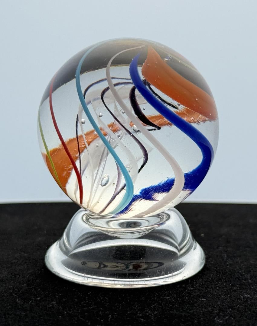 Jim Davis Art Glass Marble: 1 3/4" diameter. Signed and dated. Jim Davis, born in 1930, began to work at the Mid Atlantic Glass Company at the age of 16 making stemware and other types of glass. He quickly learned each phase of