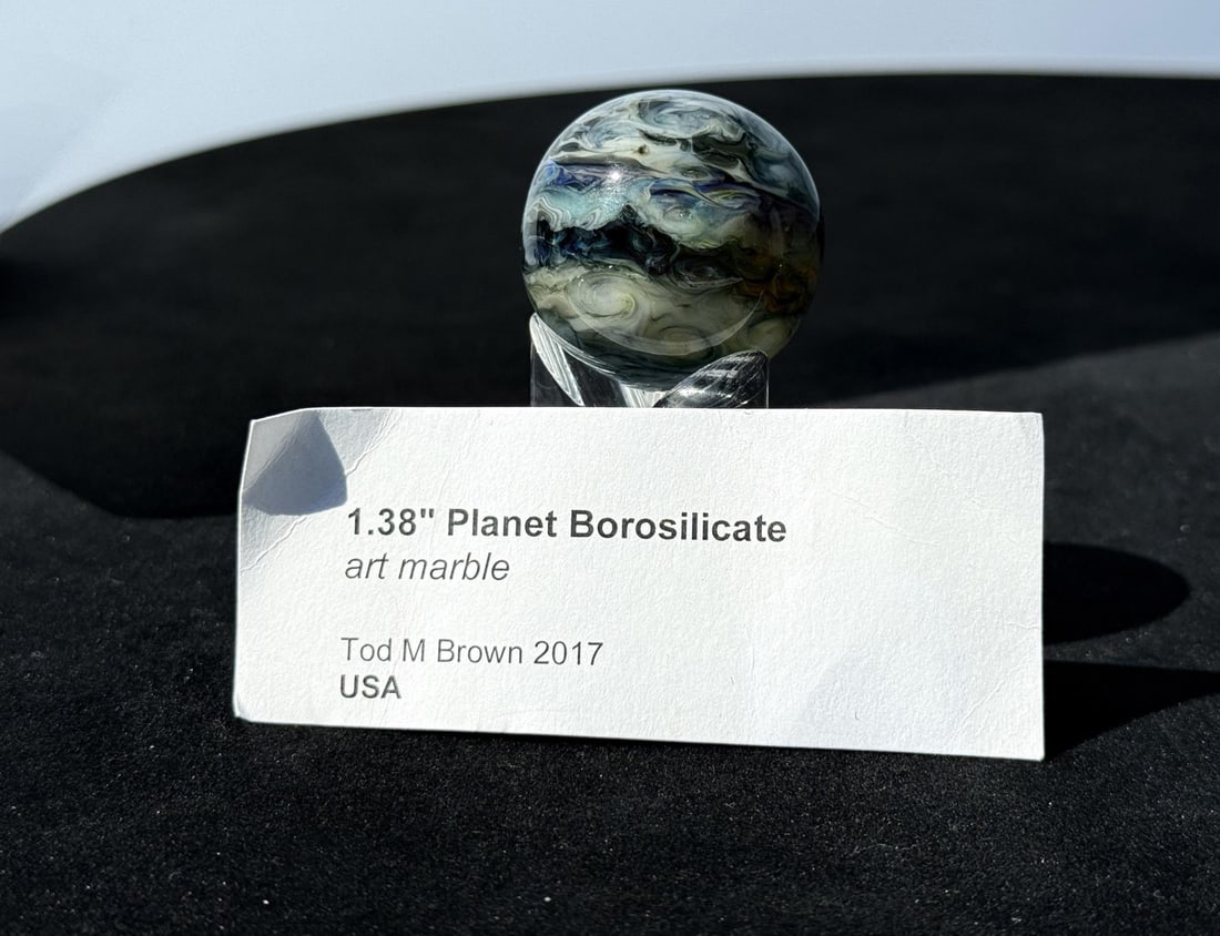 Tod Brown Planet Borosilicate Art Glass Marble: 1 3/8" diameter. Name: Tod Martin Brown (often signed as TMB, e.g. TMB 2021). Specialty: Artisan borosilicate glass marbles (lampworked/style sometimes called "planet" or "hypnotized" marbles). Locati