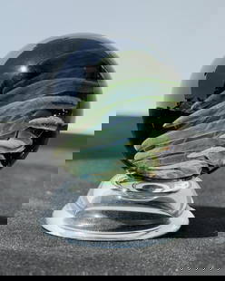 Tanner Castle Glass Borosilicate Marble: Title is Lama Sweeping Implosion #3. 1 7/8" diameter. Tanner Castle is an American glass artist renowned for his intricate and mesmerizing borosilicate marbles that blend technical mastery with a deep
