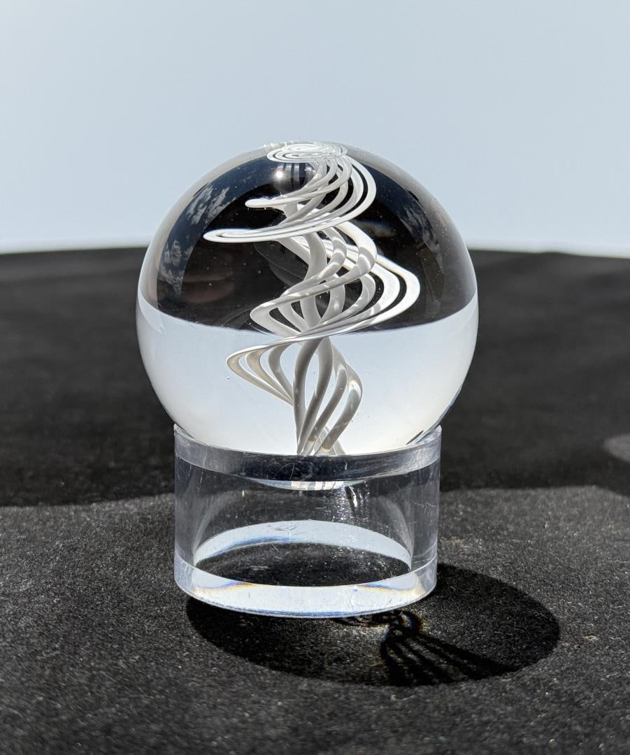 Little River Hot Glass Michael Trimpol Marble: 2" diameter. Michael Trimpol: Born in Philadelphia, PA, Michael Trimpol was first introduced to glass working during a high school stained glass course in Stowe, Vermont. He pursued a career in staine