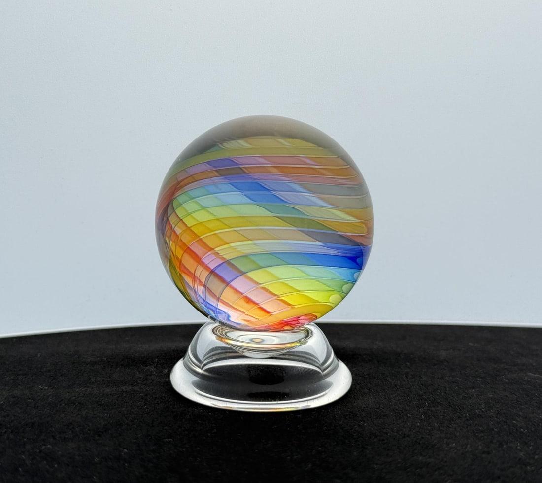 Little River Hot Glass Michael Trimpol Marble: 1 7/8" diameter. Michael Trimpol: Born in Philadelphia, PA, Michael Trimpol was first introduced to glass working during a high school stained glass course in Stowe, Vermont. He pursued a career in st