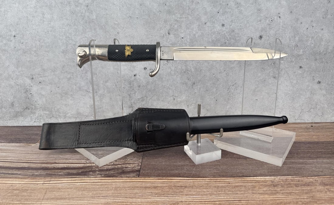 WW2 German K98 Mauser Dress Parade Bayonet: Includes scabbard and frog. The Postal Protection Police insignia on the handle might be a post war addition.