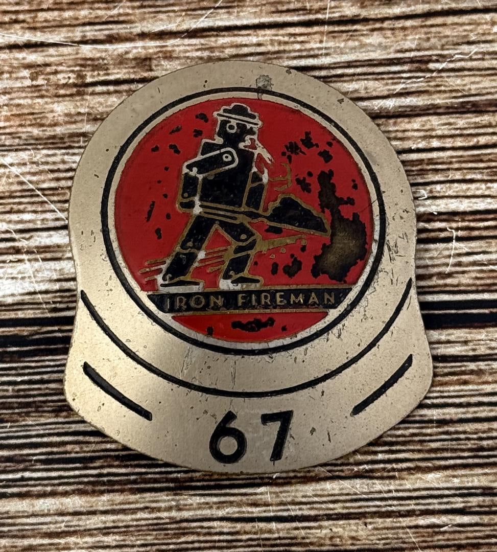 The Iron Fireman Coal Furnace Service Badge: Hard to find employee badge. 2 1/2" long.