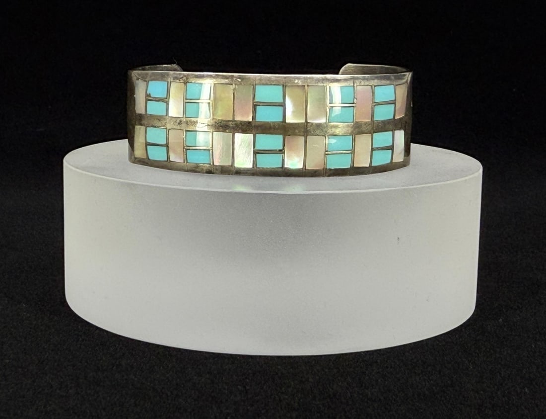 Zuni Sterling Turquoise Inlaid Sterling Bracelet: 2 1/4" by 2" by 5/8". 34.69 grams.