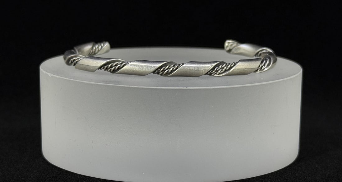 Navajo Sterling Silver Bracelet: 2 7/8" by 1 3/4" by 1/8". 19.72 grams.