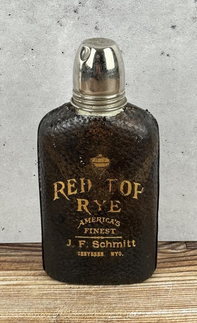 Red Top Rye Cheyenne Wyoming Whiskey Flask: J.F. Schmitt Cheyenne Wyoming. Bottle has been filled with spray foam. 6" tall.